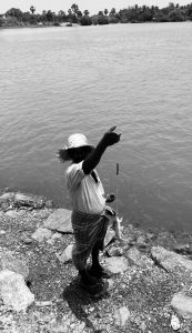 a fisherman showing his catch
